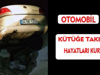 OTOMOBİL KÜTÜĞE TAKILINCA HAYATLARI KURTULDU