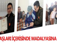 GÖZYAŞLARI İÇERİSİNDE MADALYASINA KAVUŞTU